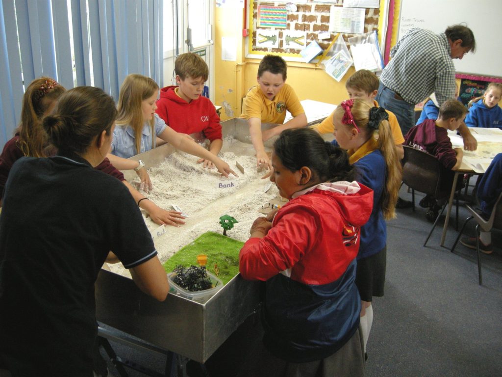 Students at Bardsey school working with the Educational River Table